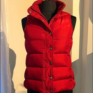 Down-filled hooded puffer vest with faux fur trim